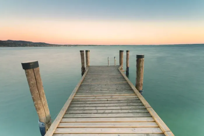 Framed Print : The wooden pier of Punta San Vigilio on the eastern shore of Lake Garda at sunset Framed Print : The wooden pier of Punta San Vigilio on the eastern shore of Lake Garda at sunset