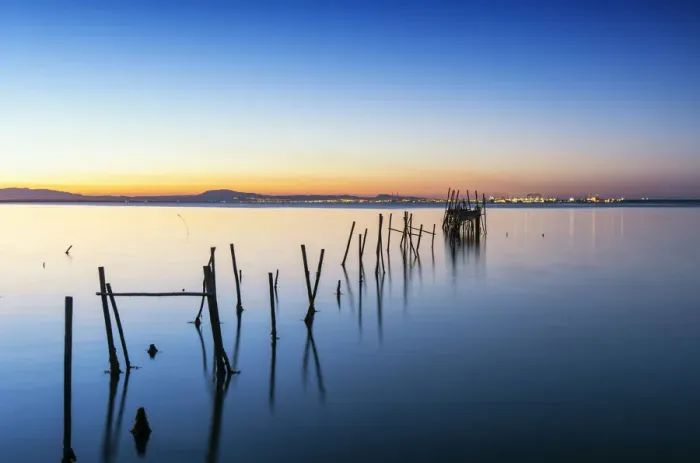 Framed Print : Wooden pillars pier, the palafite fishing harbour of Carrasqueira at dusk. Alcacer do Sal Framed Print : Wooden pillars pier, the palafite fishing harbour of Carrasqueira at dusk. Alcacer do Sal