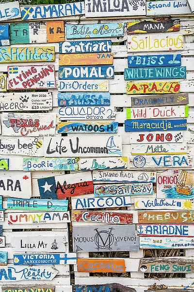 Wooden plaques of visiting boats to the Paradise Beach Club, Carriacou Island, Grenada, Caribbean