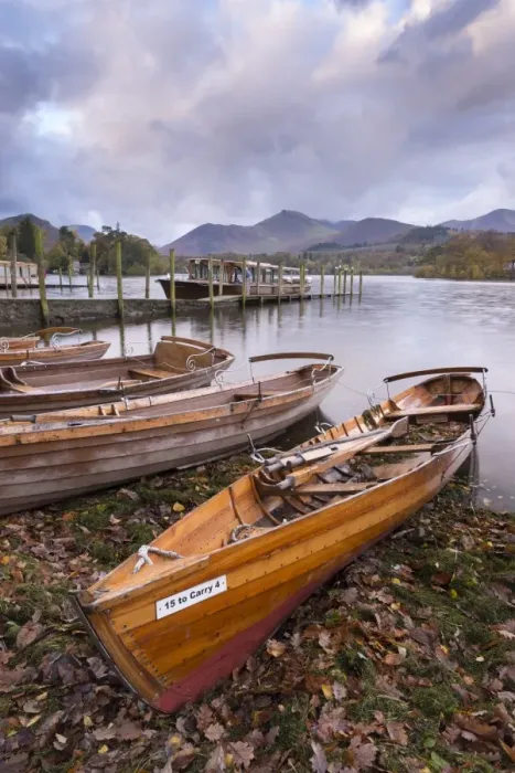 Framed Print : Wooden rowing boats beside Derwent Water in the Lake District, Cumbria, England. Autumn Framed Print : Wooden rowing boats beside Derwent Water in the Lake District, Cumbria, England. Autumn