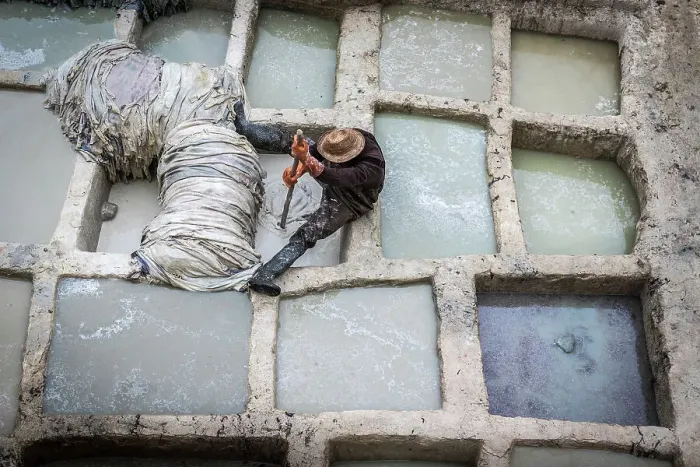 Framed Print : Worker at leather tannery, Fez, Morocco Framed Print : Worker at leather tannery, Fez, Morocco