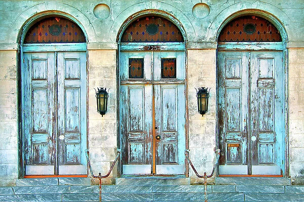 The worn doors of the historic Holy Trinity Church in the lower Faubourg Marigny section of New Orleans. Louisiana, USA
