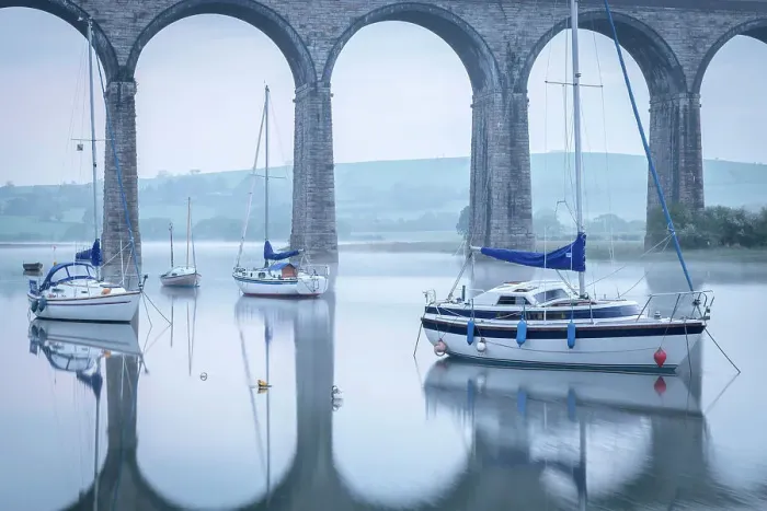 Framed Print : Yachts moored below the majestic viaduct at St Germans at dawn, Cornwall, England. Spring (April) 2022 Framed Print : Yachts moored below the majestic viaduct at St Germans at dawn, Cornwall, England. Spring (April) 2022
