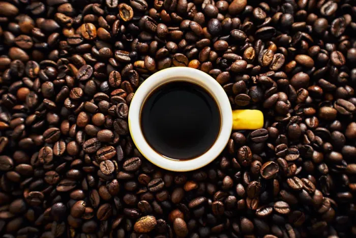Framed Print : Yellow cup of coffee with coffee beans Framed Print : Yellow cup of coffee with coffee beans