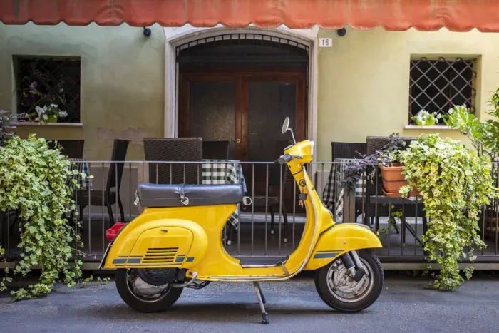 Framed Print : Yellow Vespa in Modena historic city. Modena old town, Emilia Romagna, Italy Framed Print : Yellow Vespa in Modena historic city. Modena old town, Emilia Romagna, Italy