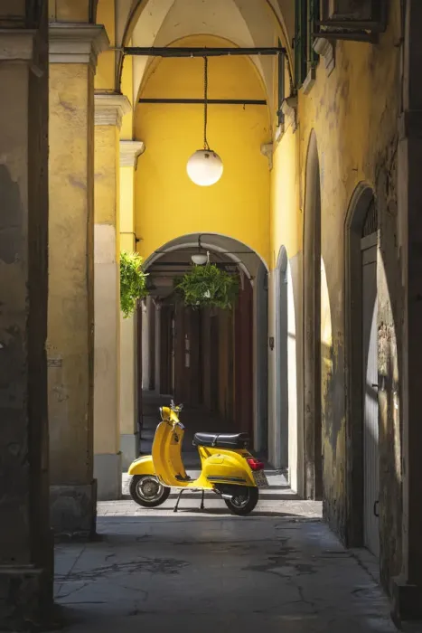 Framed Print : Yellow Vespa in Modena historic city. Modena old town, Emilia Romagna, Italy Framed Print : Yellow Vespa in Modena historic city. Modena old town, Emilia Romagna, Italy