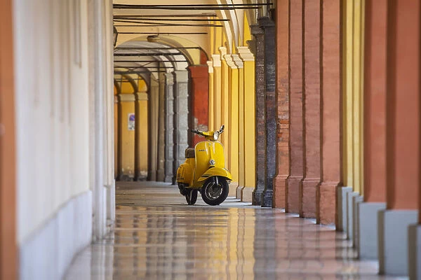 Yellow Vespa in Modena historic city. Modena old town, Emilia Romagna, Italy