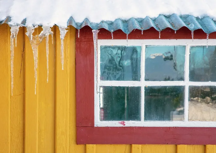 Framed Print : Yellow wall and red windowframe of old wooden house in the snow, Straumen Farm, Straumsbukta, Kvaloya, near Tromso, Norway