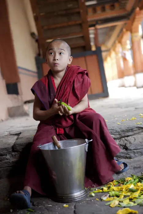 Framed Print : A young boy peeling vegetables in the dzong or monastery in Paro, Bhutan Framed Print : A young boy peeling vegetables in the dzong or monastery in Paro, Bhutan