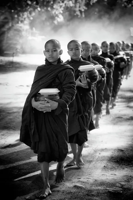 Framed Print : Young Buddhist monks collecting alms on the streets of Old Bagan, Myanmar Framed Print : Young Buddhist monks collecting alms on the streets of Old Bagan, Myanmar
