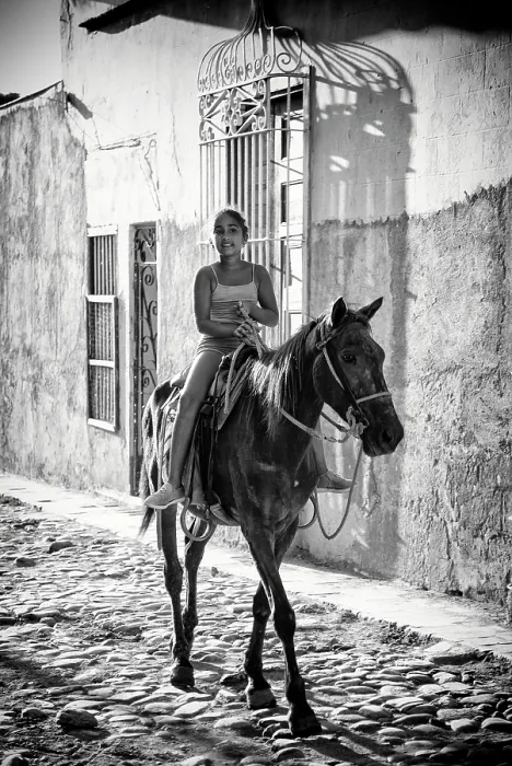 Framed Print : Young Cuban girl riding her horse on a cobbled street in the old sugar town of Trinidad (a UNESCO World Heritage Site) Cuba, Caribbean Framed Print : Young Cuban girl riding her horse on a cobbled street in the old sugar town of Trinidad (a UNESCO World Heritage Site) Cuba, Caribbean