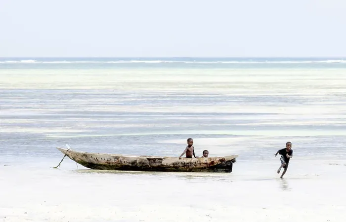 Framed Print : Young local boys playing in a dugout canoe, Zanzibar, Bweju, Tanzania Framed Print : Young local boys playing in a dugout canoe, Zanzibar, Bweju, Tanzania