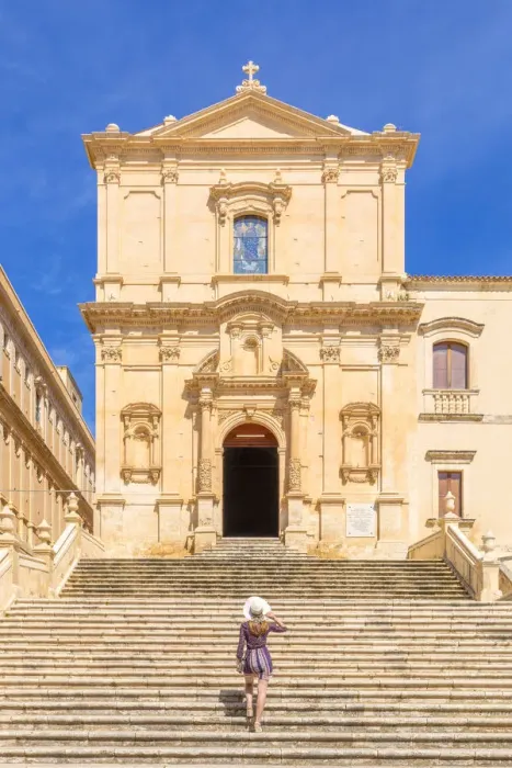 Framed Print : Young woman climbing the stairs of San Francesco all Immacolata church, Noto Framed Print : Young woman climbing the stairs of San Francesco all Immacolata church, Noto