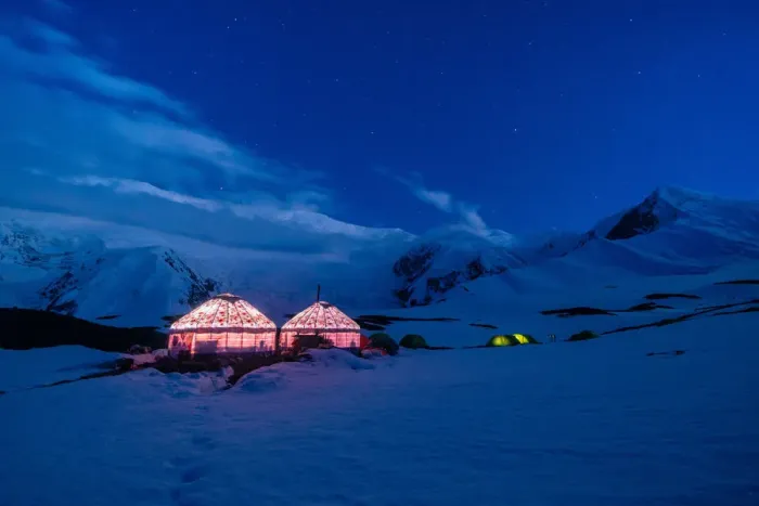 Framed Print : The yurts and tents of peak Lenin camp one illuminated at dusk with Peak Lenin massif in Framed Print : The yurts and tents of peak Lenin camp one illuminated at dusk with Peak Lenin massif in
