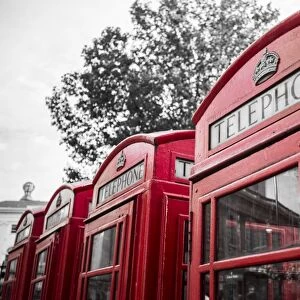 4 red telephone boxes, London, England, UK