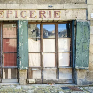 Abandoned storefront vintage painted sign of old Epicerie market store, Aubusson