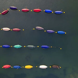 Aerial image of colourful boats moored in a harbour, Cornwall, England