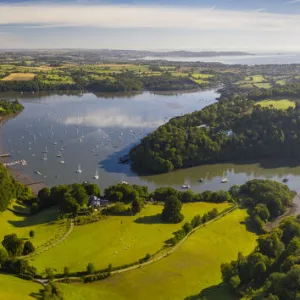 Aerial image of the village of Dittisham on the Dart Estuary, South Hams, Devon, England