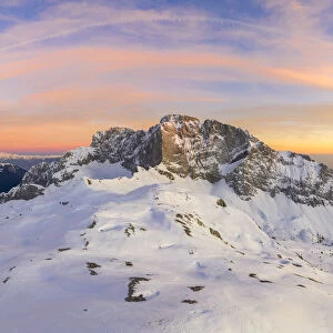 Aerial panorama of the snow-covered north face of the Presolana mountain in winter