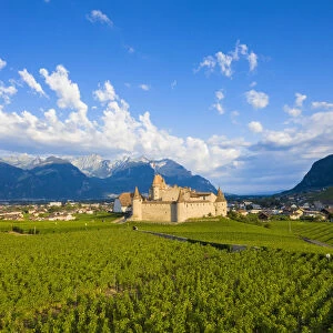 Aerial panoramic of Aigle Castle and village, canton of Vaud, Switzerland