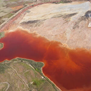 Aerial shot of oxidized iron minerals in water in old mining area, Rio Tinto