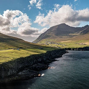 Aerial view of cliffs with Vidareidi village on background, Vidoy Island, Faroe Islands