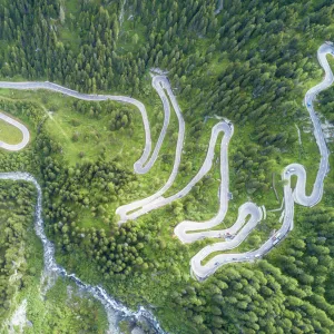 Aerial view of curves of the road between woods, Maloja Pass, Bregaglia Valley, canton