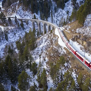 Aerial view of the famous Bernina Express passing over the Landwasser Viaduct