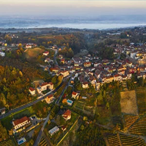 Aerial view of La Morra and vineyards during autumn at sunrise, Cuneo, Langhe e Roero