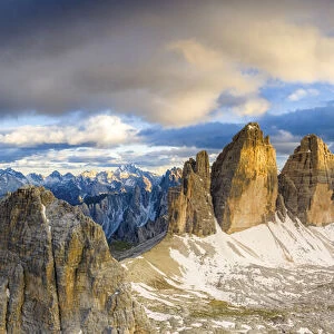 Aerial view of majestic peaks of Tre Cime di Lavaredo and Monte Paterno at sunset
