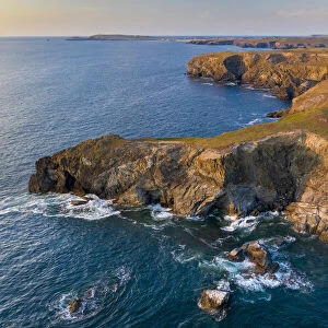 Aerial view of North Cornish rugged coastline in evening light, Park Head, Cornwall