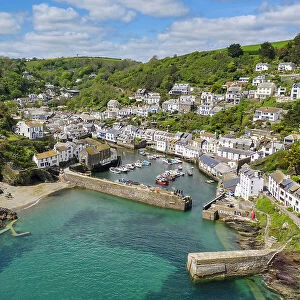 Aerial view of the picturesque Cornish harbour fishing village Polperro, Cornwall, England. Spring (May) 2022