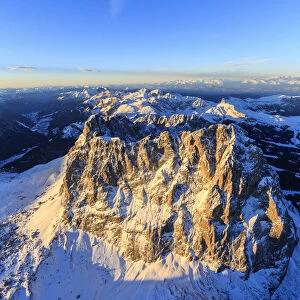 Aerial view of Sassolungo Sassopiatto and Grohmann peak at sunset