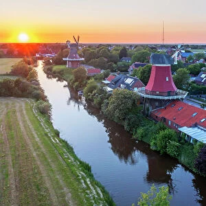 Aerial view at the Sunset at the Twinmills of Greetsiel, Krummhorn, East Frisia, Lower Saxony, Germany