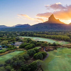 Aerial view of Tamarina golf course with Rempart mountain and Trois mamelles mountain