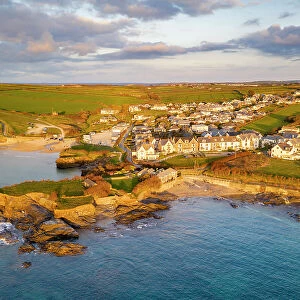 Aerial view of Trevone Bay, beach and village in evening sunlight, Trevone, Cornwall