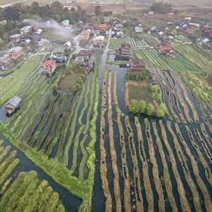 Aerial view of village and floating gardens before sunrise, Lake Inle