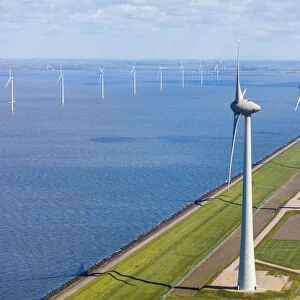 Aerial view of wind turbines on land and at sea, North Holland, Netherlands