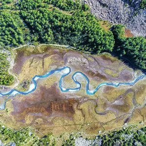 Aerial view of the winding Duino river in autumn in Preda Rossa valley. Val Masino, Sondrio province, Lombardy, Italy Aerial view of the winding Duino river in autumn in Preda Rossa valley. Val Masino, Sondrio province, Lombardy, Italy
