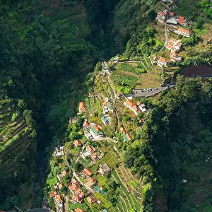 Aerial view of winding road and house on hill slope, Curral das Freiras (Pen of the Nuns), Camara de Lobos, Madeira, Portugal