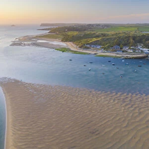 Aerial vista of sunset over the Camel Estuary and Rock, Cornwall. England