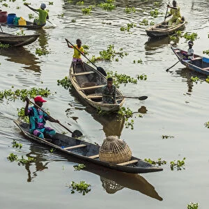 Africa, Benin, Lake Nokoua. Boat traffic in the famous stilt village of Ganvie