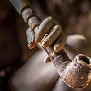 Africa, Benin, Taneka Koko. a detail of the hand of the traditional healer holding