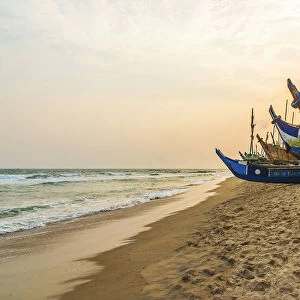 Africa, Ghana, Elmina and surroundings. Traditional fishing boats on the beach in