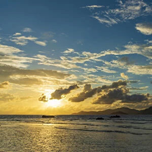 Africa, Seychelles, La Digue. Sunset seen from Anse Severe towards the Island of Praslin