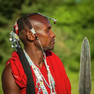 africa, Tanzania, Manyara Region. A young Maasai Warrior posing with his spear africa, Tanzania, Manyara Region. A young Maasai Warrior posing with his spear