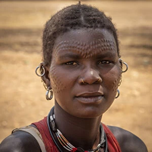 Africa, Uganda, Karamoja. Moroto. Portrait of a woman with scarification at Nakapelimoru