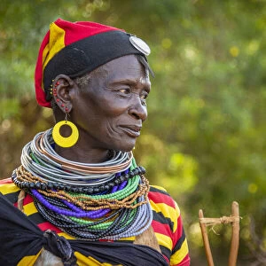 Africa, Uganda, Karamoja. Namalu. A beautiful elder woman during a wedding ceremony traditionally dressed