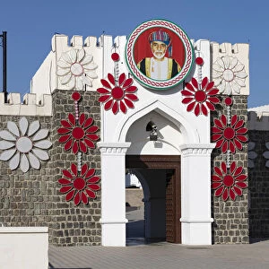 Al Alam Palace decorated with flowers and a picture of Sultan Qaboos, Muscat, Oman