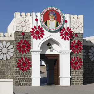 Al Alam Palace decorated with flowers and a picture of Sultan Qaboos, Muscat, Oman